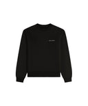 Black sweatshirt with a small white logo on a light gray background